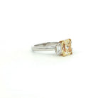 Fancy Yellow Radiant Cut Diamond Three-Stone Ring in Platinum & 18K Yellow Gold - Jackson Hole Jewelry Company