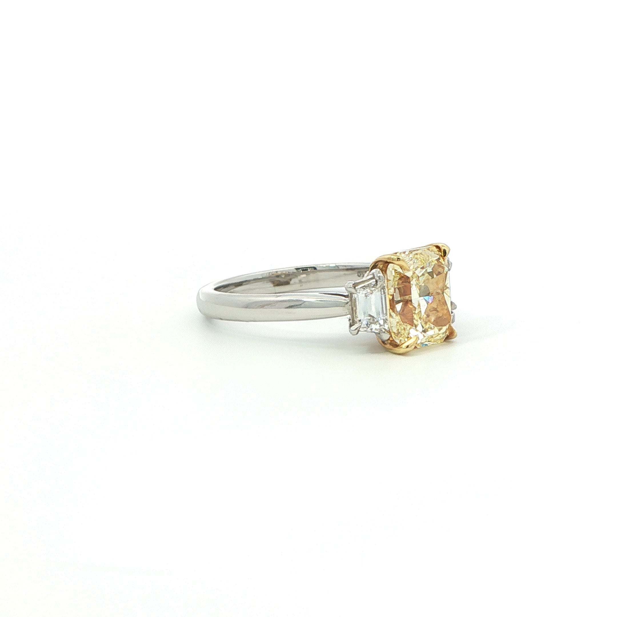 Fancy Yellow Radiant Cut Diamond Three-Stone Ring in Platinum & 18K Yellow Gold - Jackson Hole Jewelry Company